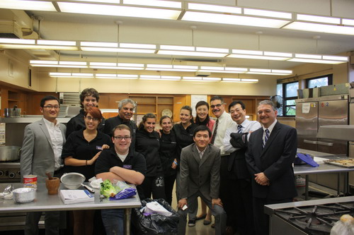 Group photo with the Tottenville high school teachers and students at the school kitchen. 